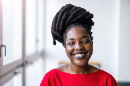 179903140 portrait of a smiling young woman indoors